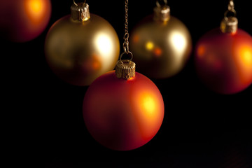 Christmas baubles on black background