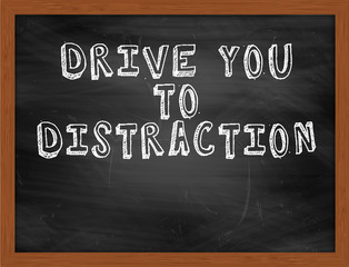 DRIVE YOU TO DISTRACTION handwritten text on black chalkboard
