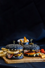 black burgers on a black background