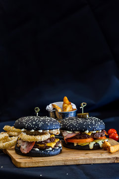 black burgers on a black background