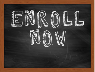 ENROLL NOW handwritten text on black chalkboard