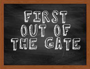 FIRST OUT OF THE GATE handwritten text on black chalkboard