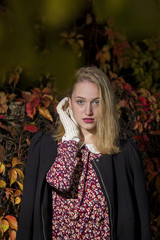 Young woman enjoying an autumn day in the park