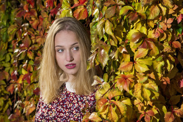 Young woman enjoying an autumn day in the park