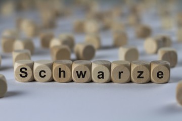 Schwarze - Holzwürfel mit Buchstaben