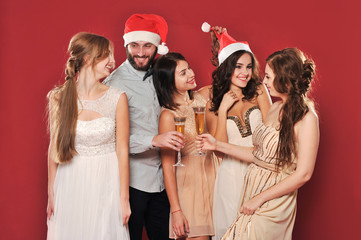 a group of people
with a glass of champagne meet new year