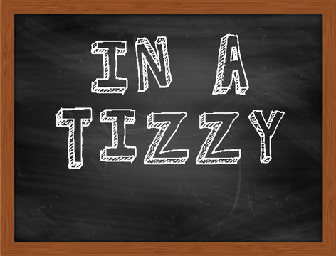 IN A TIZZY handwritten text on black chalkboard