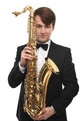 Fototapeta na wymiar Attractive saxophonist with a saxophone in suit.