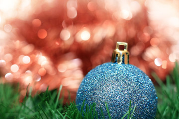 Blue christmas decoration ball with red bokeh