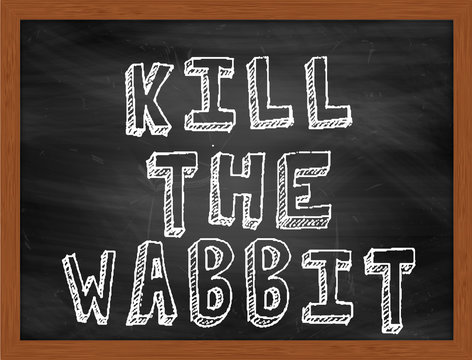 KILL THE WABBIT handwritten text on black chalkboard