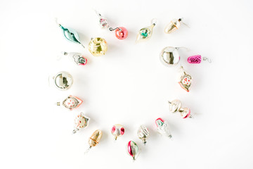 creative arrangement frame of bright christmas balls and toys on white background. flat lay, top view