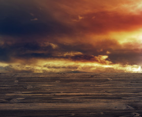 Empty wood table top on blur background of the clouds and sunset.  For montage product display