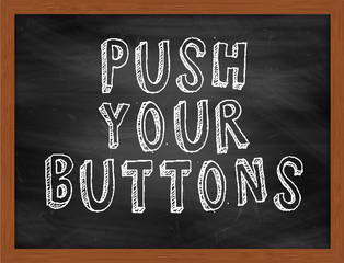 PUSH YOUR BUTTONS handwritten text on black chalkboard