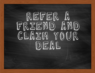 REFER A FRIEND AND CLAIM YOUR DEAL handwritten text on black cha