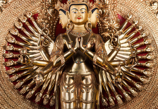 With thousand arms a bodkhisattva of an avalokiteshvara - The statue made of bronze.