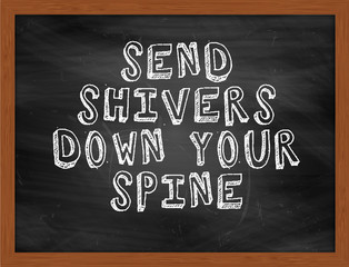 SEND SHIVERS DOWN YOUR SPINE handwritten text on black chalkboar