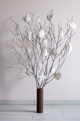 Christmas tree made from branches and vintage balls and decorati