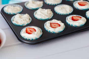 Delicious sweet cupcakes with strawberry