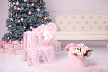 Christmas interior with Christmas tree in soft pink color