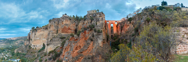 Panorama of Puente Nuevo, New Bridge, at night illuminated over the Tajo Gorge in Ronda, Andalusia, Spain