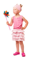 Cute little blond girl blowing windmill isolated on white.