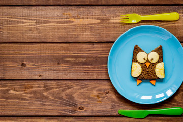 kids breakfast owl shaped sandwich on blue plate top view
