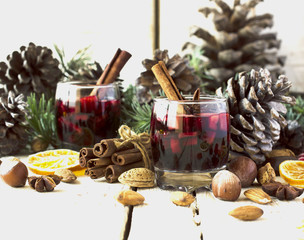 New Year or Christmas composition with walnuts, mulled wine, hazelnuts