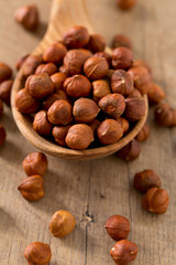 hazelnuts on wooden surface