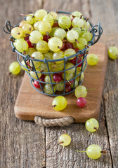 gooseberries on wooden surface