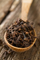 cloves in a wooden spoon