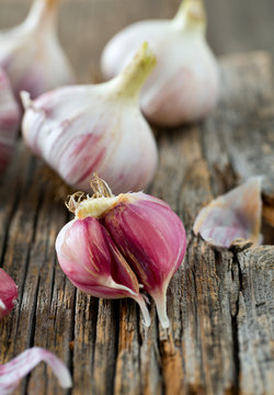 fresh garlic on wooden surface