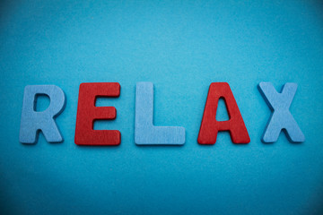 word relax on blue background