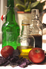 Tomatoes and basilic, olive oil and balsamic in bottles