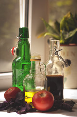 Tomatoes and basilic, olive oil and balsamic in bottles