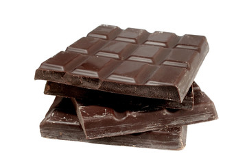 Pieces of dark chocolate isolated on white background
