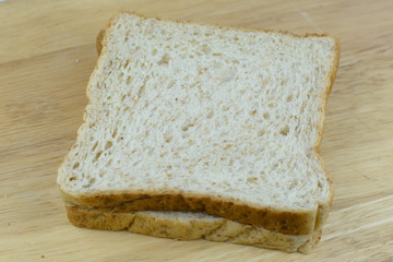 Bread whole wheat on wood background