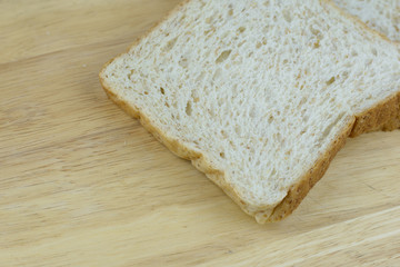 Bread whole wheat on wood background