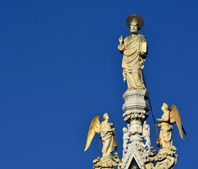 Fototapeta premium Saint Mark blessing with angels at the top of Venice Basilica (with copy space)