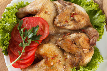 roasted chicken and potatoes on white plate