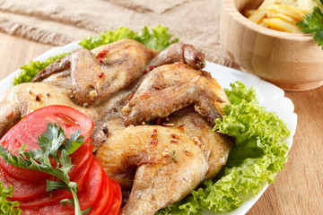 roasted chicken and potatoes on white plate
