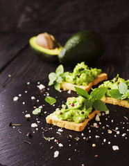 toast with a paste of avocado and pesto basil, spices