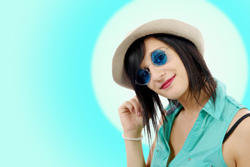 pretty brunette girl with a summer hat and blue sunglasses
