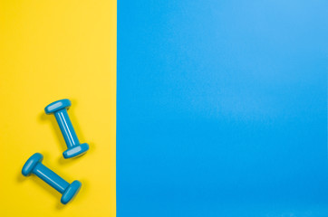 Sport, fitness and healthy lifestyle concept image on bright colorful background. Photograph taken from above, top view.