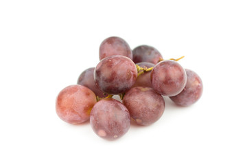 Ripe red grape with leaves isolated on white