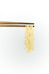 chopsticks noodles isolated on white background