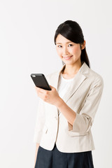 Fototapeta premium portrait of asian businesswoman using smart phone isolated on white background