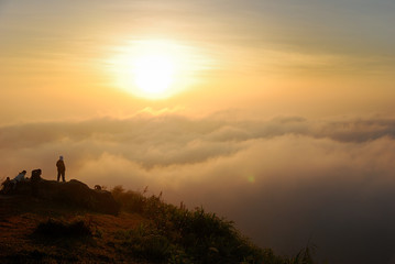The gorgeous sea fog with a group of people at the top of Phu Tub Berk (Tub Berk mountain) in morning at Phetchabun, Thailand