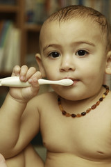 One and Half Years Old Baby Girl Brushing Her Teeth after a Shower 