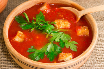 Gazpacho soup with croutons and herbs. National Spanish cuisine.