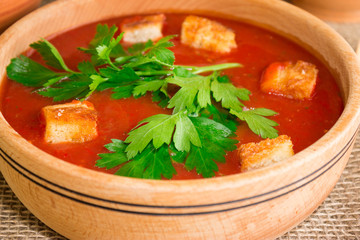 Gazpacho soup with croutons and herbs. National Spanish cuisine.